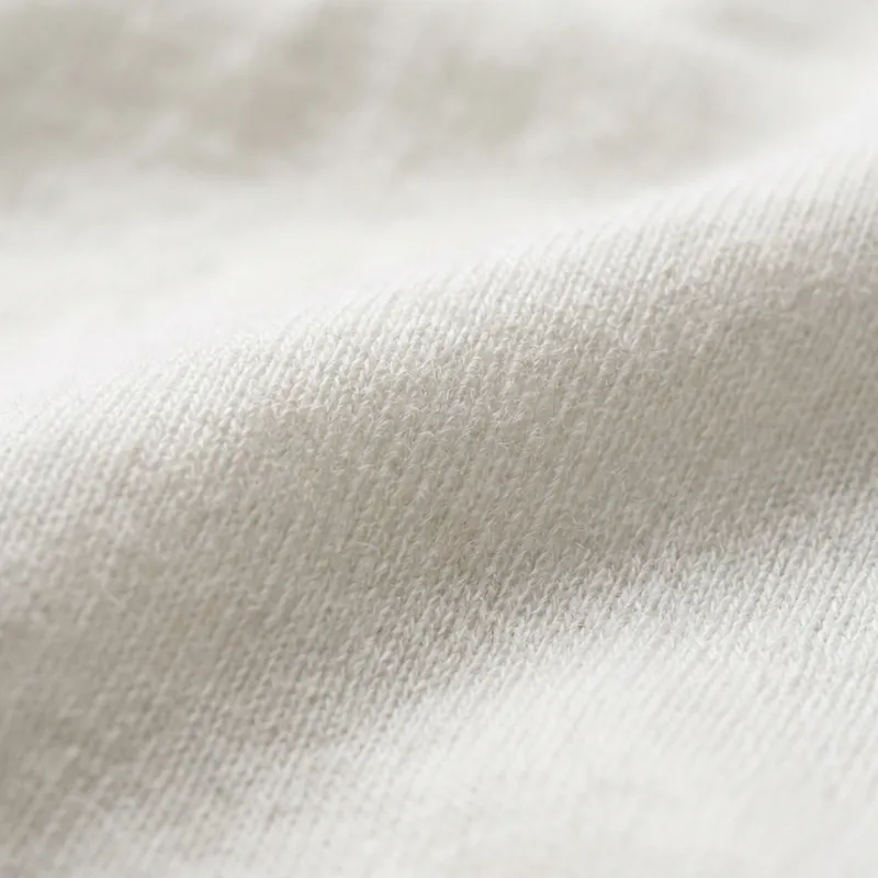 Close-up of soft off-white cotton jersey fabric