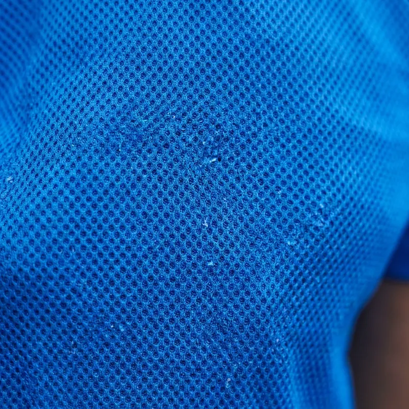 Close-up of blue perforated performance polyester fabric